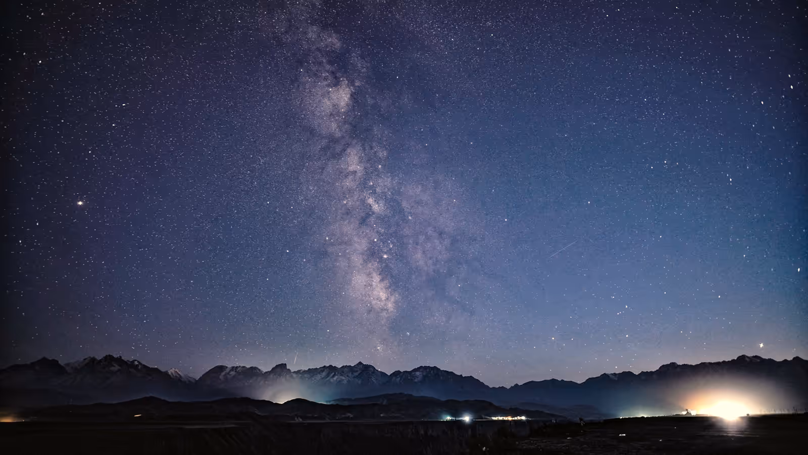 The Milky Way over a mountain range at night