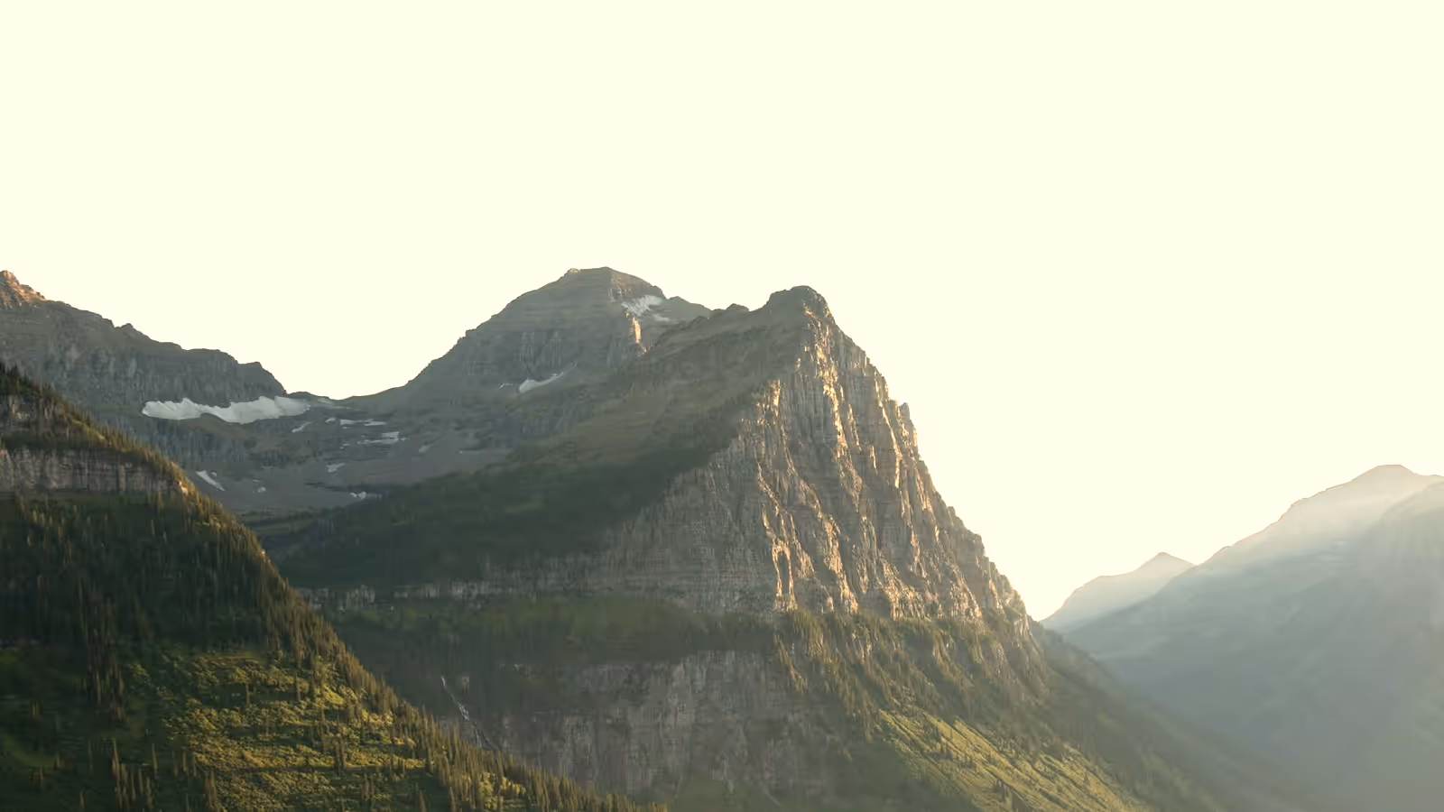 Golden sunrise light on a rugged mountain peak