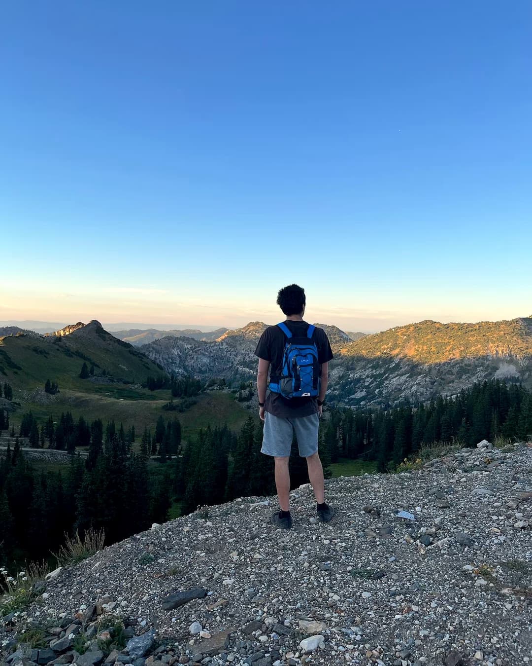 Jess LeFevre, CHPC standing on a mountain peak in Alta, Utah